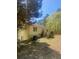 View of the home's backyard with steps leading up to the double doors and yard at 1905 Rockmart Rd, Villa Rica, GA 30180