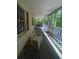 Enjoy nature from the comfort of the covered porch, perfect for relaxing at 1905 Rockmart Rd, Villa Rica, GA 30180