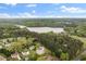 Picturesque aerial view of a home in a wooded area near a lake at 160 Fieldstone Dr, Powder Springs, GA 30127
