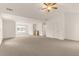 This large, bonus room has neutral carpet and vaulted ceilings, offering flexible living space at 160 Fieldstone Dr, Powder Springs, GA 30127