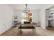 Bright dining room featuring modern decor, stylish table, and large windows at 160 Fieldstone Dr, Powder Springs, GA 30127
