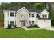 Charming two-story home featuring a lush green lawn, brick facade, and attached two-car garage at 160 Fieldstone Dr, Powder Springs, GA 30127