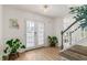 Bright and inviting foyer with a staircase, hardwood floors, and tasteful decorations at 160 Fieldstone Dr, Powder Springs, GA 30127