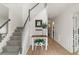 Bright and inviting foyer with a staircase, hardwood floors, and tasteful decorations at 160 Fieldstone Dr, Powder Springs, GA 30127