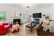 Comfortable living room with a cozy fireplace, ample seating, and a large television at 160 Fieldstone Dr, Powder Springs, GA 30127