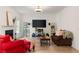 Bright living room featuring a modern entertainment setup, comfortable seating, and stylish decor at 160 Fieldstone Dr, Powder Springs, GA 30127