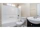 Bright bathroom featuring a shower-tub combo, toilet, and vanity with a sink at 175 Regency Park Dr, Mcdonough, GA 30253