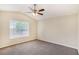 Spacious bedroom with neutral carpet, vaulted ceiling, ceiling fan, and large window offering plenty of natural light at 175 Regency Park Dr, Mcdonough, GA 30253