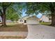 Traditional one-story home featuring a driveway, garage and well-maintained lawn, inviting and perfect for a growing Gathering at 175 Regency Park Dr, Mcdonough, GA 30253