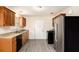 Kitchen featuring stainless steel appliances, granite counters, and wood cabinets at 175 Regency Park Dr, Mcdonough, GA 30253