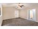Living room featuring plush carpet flooring, neutral walls, and entry to bathroom at 175 Regency Park Dr, Mcdonough, GA 30253