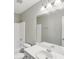 Bathroom featuring a white toilet, shower and vanity and large mirror at 1945 Grayson Oaks Ct, Lawrenceville, GA 30045