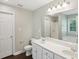 Bright bathroom with white cabinetry and dual sinks at 1945 Grayson Oaks Ct, Lawrenceville, GA 30045