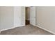 Bedroom includes neutral paint, carpeting and a doorway into another area at 1945 Grayson Oaks Ct, Lawrenceville, GA 30045