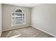 Bedroom with neutral paint, plush carpet, and a bright window at 1945 Grayson Oaks Ct, Lawrenceville, GA 30045