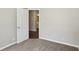 Bedroom with neutral paint and carpet, with a view of the connected bathroom space at 1945 Grayson Oaks Ct, Lawrenceville, GA 30045