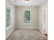 Cozy bedroom featuring a pair of windows for natural light at 1945 Grayson Oaks Ct, Lawrenceville, GA 30045