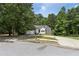 Charming one-story home with stone accents, well-maintained lawn, and a spacious driveway at 1945 Grayson Oaks Ct, Lawrenceville, GA 30045