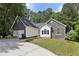 Attractive one-story home featuring stone accents, well-manicured lawn and a wide driveway at 1945 Grayson Oaks Ct, Lawrenceville, GA 30045