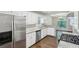 Spacious kitchen view includes stainless appliances, granite counters, and eat in dining area at 1945 Grayson Oaks Ct, Lawrenceville, GA 30045