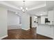 View of the living space with kitchen, dining area and Gathering room with ceiling fan at 1945 Grayson Oaks Ct, Lawrenceville, GA 30045