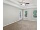 Main bedroom with tray ceiling, ceiling fan, and access to outdoor deck at 1945 Grayson Oaks Ct, Lawrenceville, GA 30045