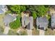 Aerial view showcasing a home with mature trees surrounding the property and a well-maintained yard at 248 Colony Center Dr, Woodstock, GA 30188