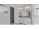 Bathroom boasts double sinks, granite countertops, and generous storage with a walk-in closet at 248 Colony Center Dr, Woodstock, GA 30188