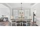 Dining room featuring hardwood floors and adjacent kitchen at 248 Colony Center Dr, Woodstock, GA 30188