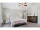 This main bedroom has vaulted ceilings, neutral carpet and paint, and dual windows for plenty of light at 248 Colony Center Dr, Woodstock, GA 30188