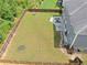 Expansive fenced backyard with a stone patio and ample space for outdoor activities at 3687 Thackary Dr, Powder Springs, GA 30127