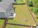 Large fenced backyard featuring a stone patio, perfect for entertaining and relaxation at 3687 Thackary Dr, Powder Springs, GA 30127