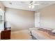Calm and comfortable bedroom with ceiling fan and a TV at 3687 Thackary Dr, Powder Springs, GA 30127