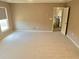 Inviting bedroom with neutral carpet, plenty of sunlight, and a hallway entrance for added privacy at 3687 Thackary Dr, Powder Springs, GA 30127
