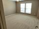 Neutral bedroom with carpet, ceiling fan, and two windows at 3687 Thackary Dr, Powder Springs, GA 30127