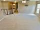 Open and airy bonus room with carpet, a ceiling fan, neutral walls, and bright windows at 3687 Thackary Dr, Powder Springs, GA 30127