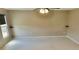Empty carpeted bonus room featuring neutral walls, a ceiling fan, two floating shelves, and a large window at 3687 Thackary Dr, Powder Springs, GA 30127