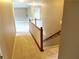 Upstairs hallway with carpet, painted walls, wood trim, and doors to various rooms at 3687 Thackary Dr, Powder Springs, GA 30127