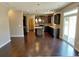 Modern kitchen featuring dark wood cabinets, a center island, stainless steel appliances, and hardwood flooring at 3687 Thackary Dr, Powder Springs, GA 30127