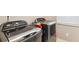 Well-equipped laundry room featuring modern, side-by-side washer and dryer units, convenient for everyday chores at 3687 Thackary Dr, Powder Springs, GA 30127