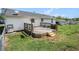 View of the wooden deck and backyard in the rear of the house, ready for outdoor enjoyment at 5794 Parks Rd, Cumming, GA 30041