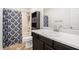 Neat bathroom with a shower/tub, vanity and cabinet for storage at 5794 Parks Rd, Cumming, GA 30041