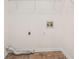 Spacious laundry room featuring neutral paint, linoleum flooring, and wire shelving at 5794 Parks Rd, Cumming, GA 30041
