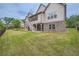 Expansive backyard view showcasing the home's outdoor living space and well-maintained lawn at 631 Mabry Rd, Sandy Springs, GA 30328