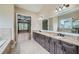 Spacious bathroom with double vanity and large mirror that leads to the main bedroom for a spa like experience at 631 Mabry Rd, Sandy Springs, GA 30328