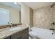 Bathroom with granite countertop, sink, and shower-tub combo at 631 Mabry Rd, Sandy Springs, GA 30328