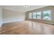 Bright and spacious bedroom with hardwood floors and three large windows at 631 Mabry Rd, Sandy Springs, GA 30328