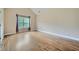 An empty bedroom showcasing hardwood floors and a window at 631 Mabry Rd, Sandy Springs, GA 30328