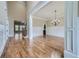 Elegant dining room with hardwood floors, wainscoting, and a stylish chandelier, perfect for entertaining guests at 631 Mabry Rd, Sandy Springs, GA 30328