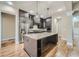 Modern kitchen with a large center island, stainless steel appliances, and sleek cabinetry for a chef-inspired space at 631 Mabry Rd, Sandy Springs, GA 30328
